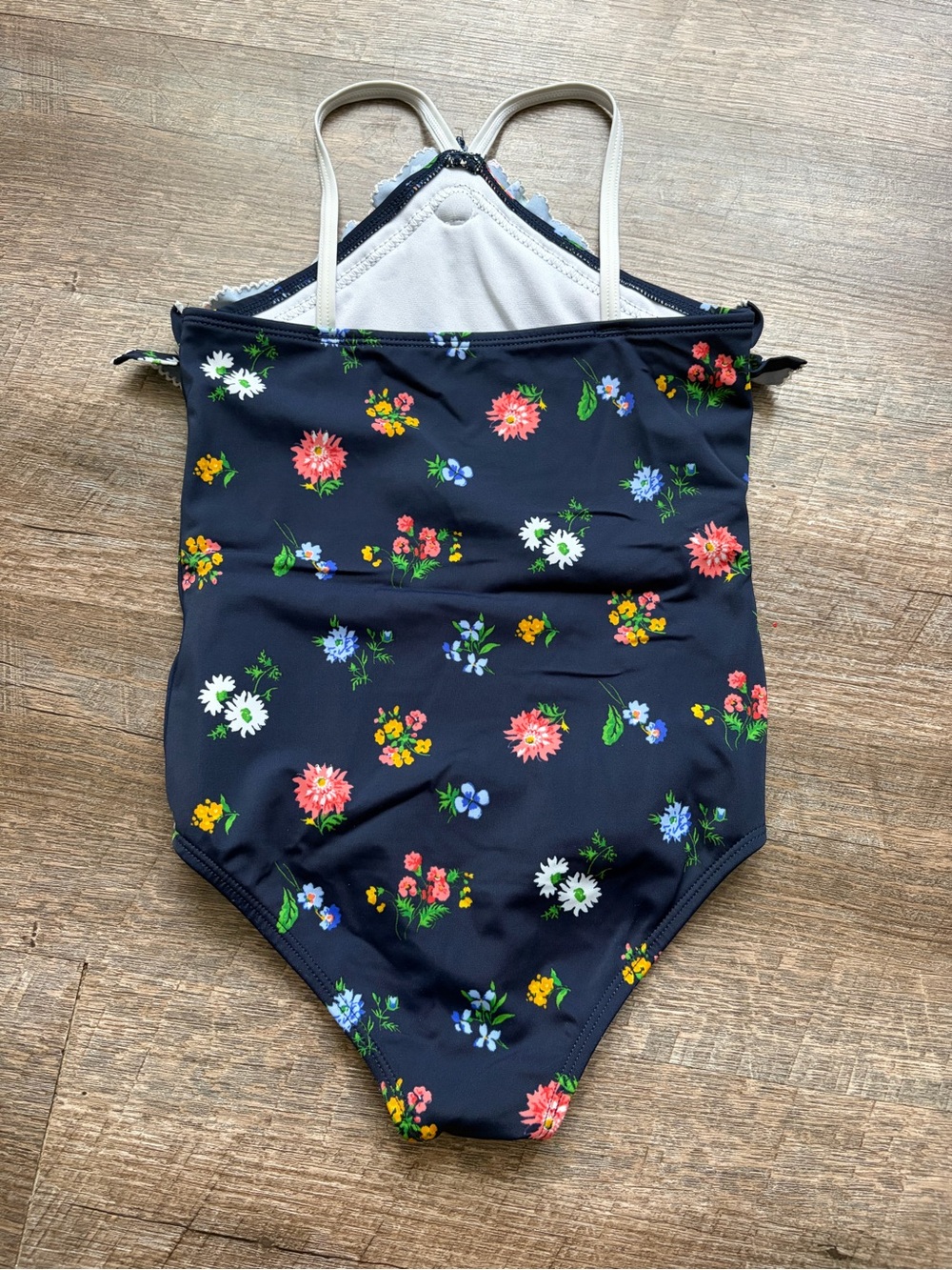 🌸$10 SALE 🌸 Girls Navy Floral Ruffle One-Piece Swimsuit with White Flower - Picture 4 of 4